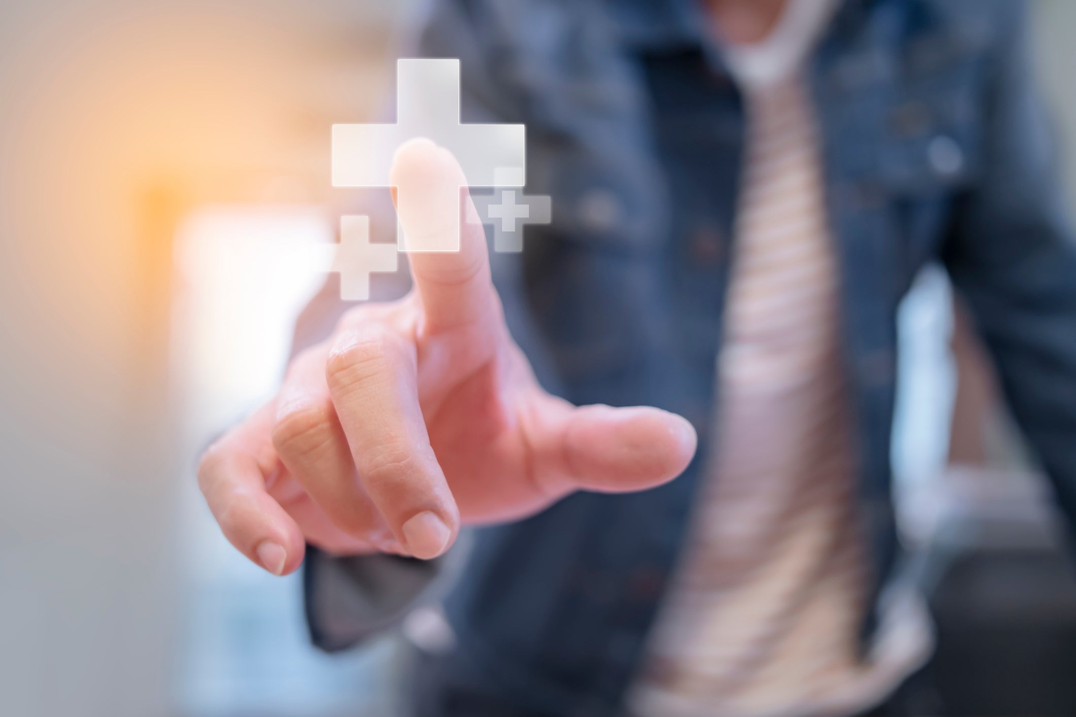 Person clicks health plus sign